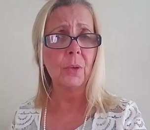 Photo of white female with blonde hair, blue glasses and lace shirt greeting the Contact Page at The Write Copywriter